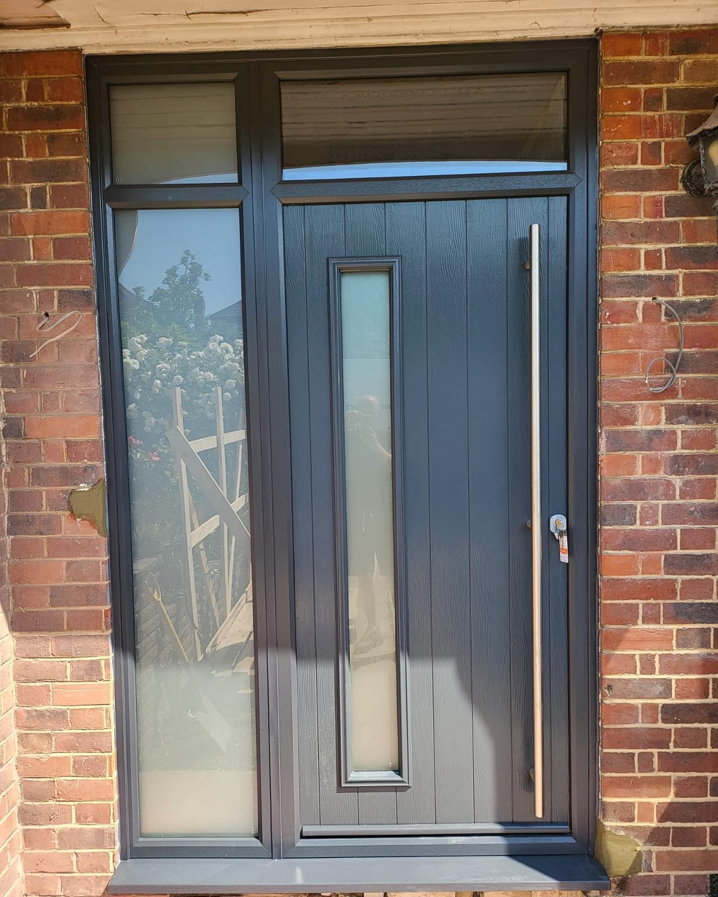 Anthracite composite front door, period red brick property Surrey
