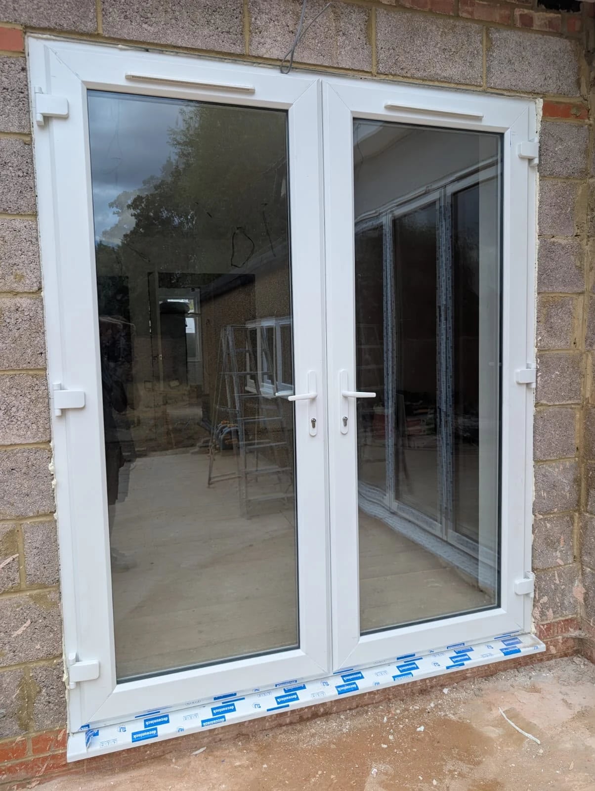Deceuninck uPVC French doors, fitted during the build