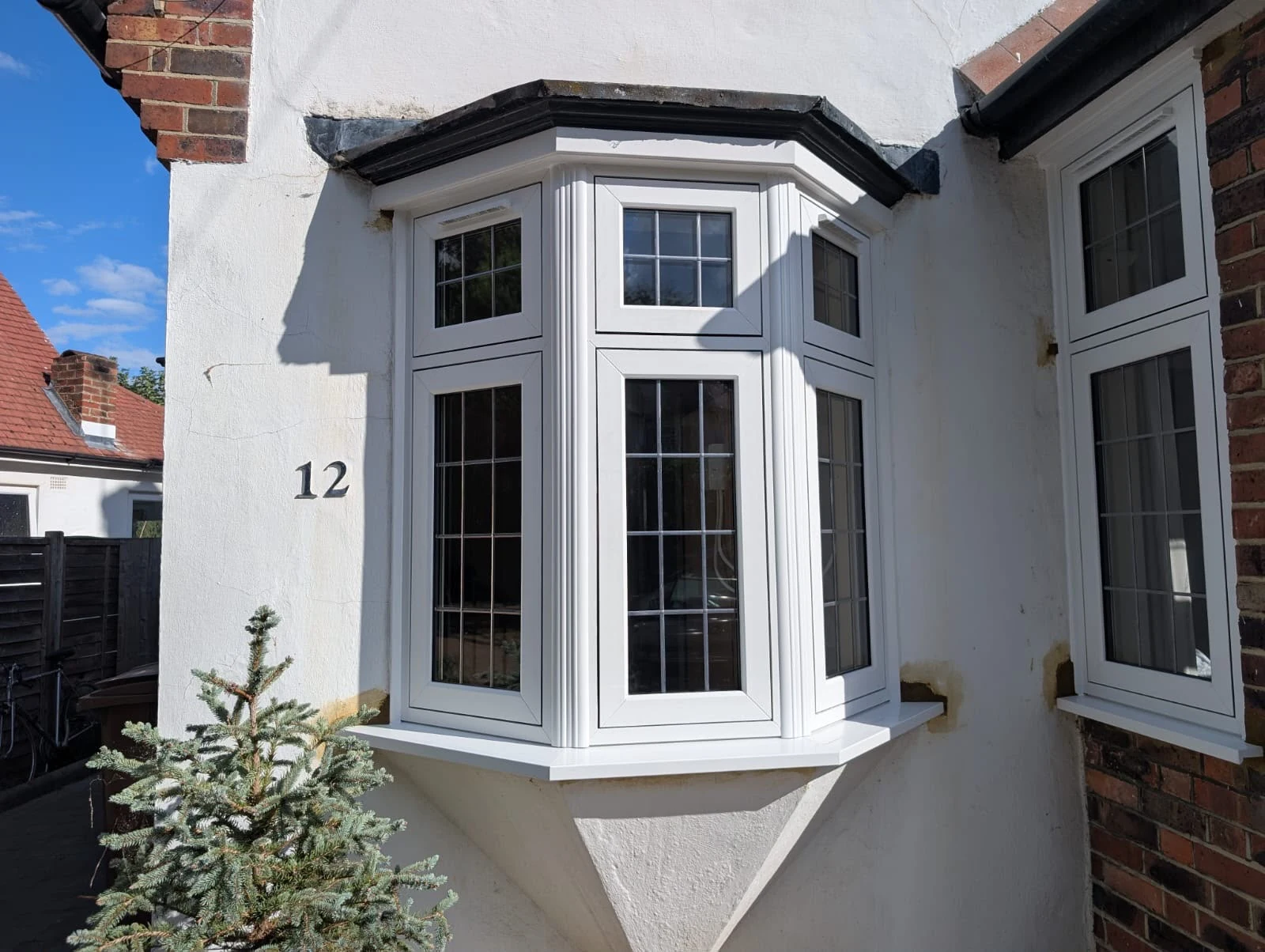 White leaded bay window on a period home — by A1 Window Construction Ltd