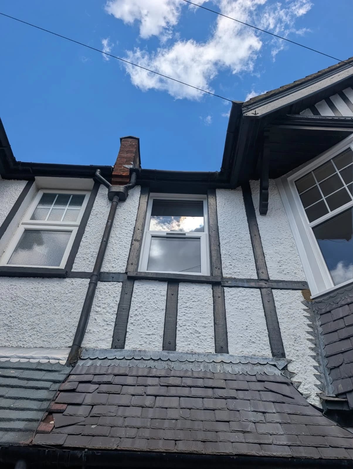 Vertical sliding window set into the timber framing