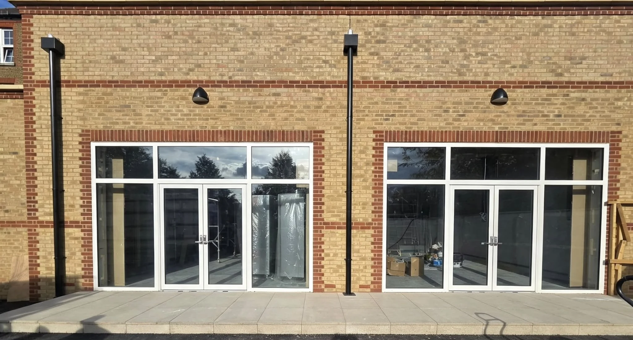 Glazed double-door frontages on two new-build commercial units — by A1 Window Construction Ltd