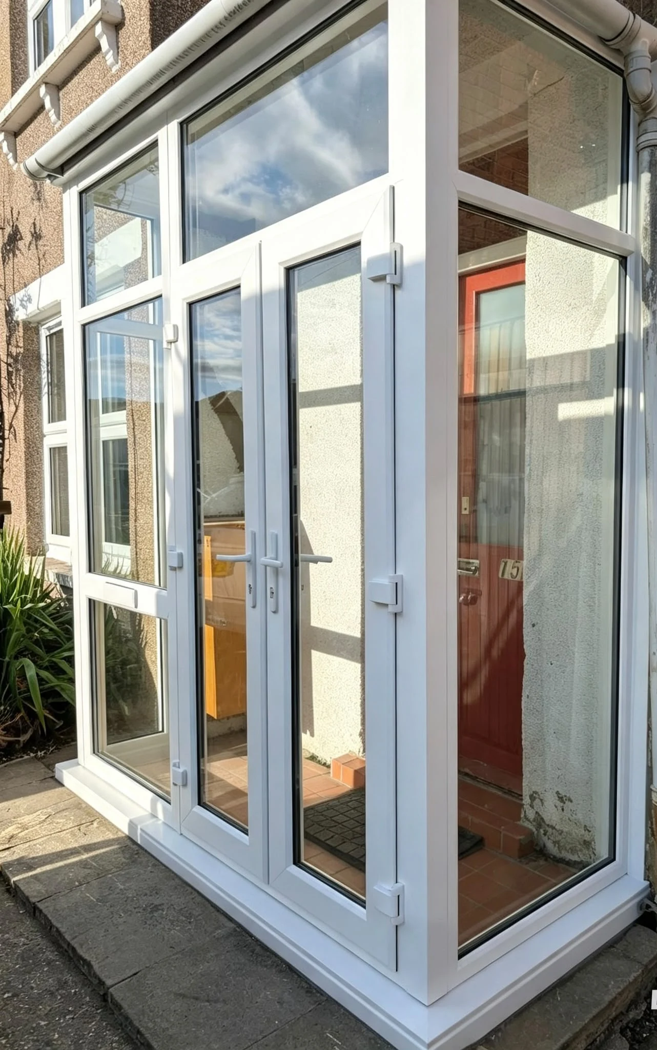 White glazed porch with French doors on a terraced house — by A1 Window Construction Ltd
